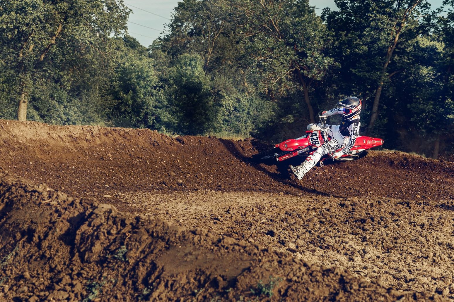 Motocross rider carving a berm at Joliet MX